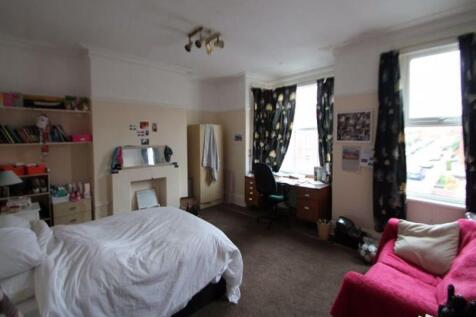 Bright and spacious bedroom featuring a comfort...