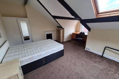 Bright and cozy double bedroom featuring a larg...