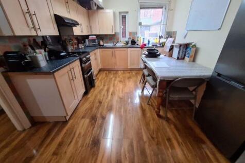 Bright and functional kitchen featuring ample w...