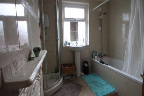 A well-maintained bathroom featuring both a bat...