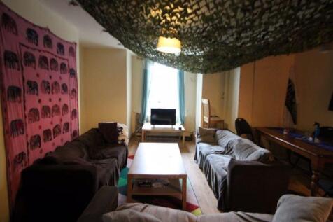 A cozy living room with comfortable seating, a ...