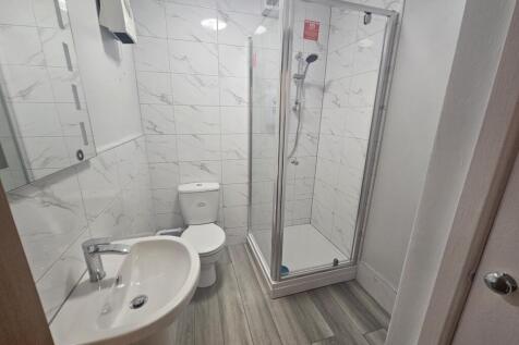 Bright and modern bathroom featuring a clean, g...