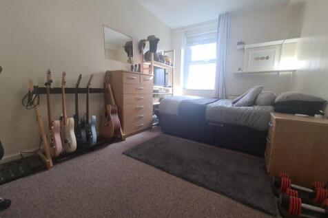 Well-kept living area with a comfortable sofa, ...