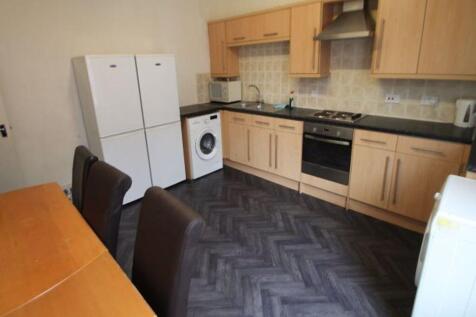 A well-maintained kitchen featuring ample cabin...