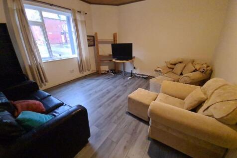 A cozy living room featuring comfortable sofas ...