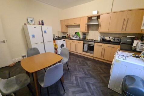 A bright and functional kitchen featuring ample...