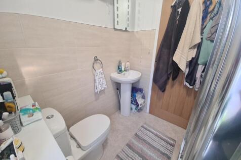 Well-maintained bathroom featuring a toilet, pe...