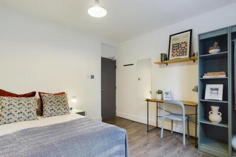 A stylish and inviting double bedroom featuring...