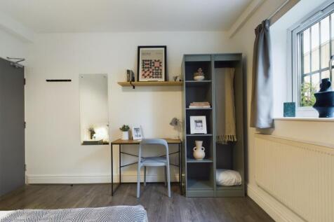 A bright and tidy double bedroom, featuring a s...