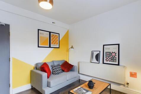 A stylish and inviting living room featuring mo...