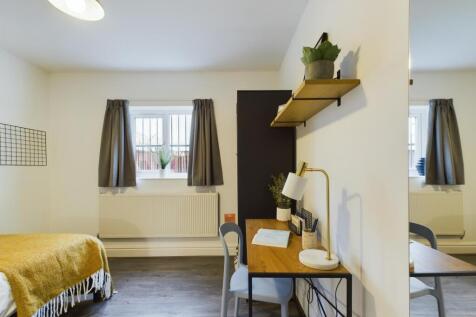A bright and inviting double bedroom featuring ...