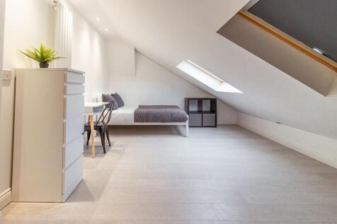 Bright, minimalist attic double bedroom with a ...