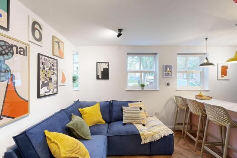 Bright, modern open-plan living area with a com...