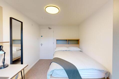 Bright, neatly presented bedroom with a comfort...