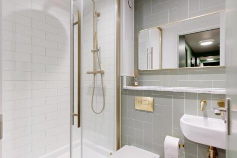 Contemporary bathroom with walk-in shower, wall...