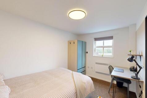 Bright, neatly presented bedroom with a double ...