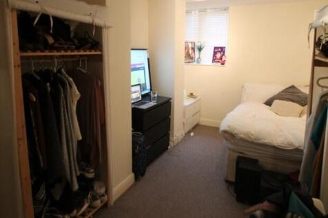 Cozy furnished bedroom with a comfortable bed, ...