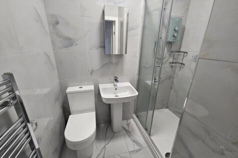 A modern, well-maintained bathroom featuring a ...