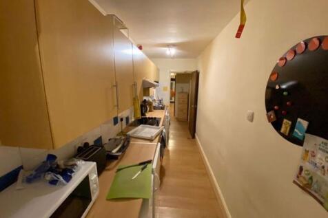 A well-equipped kitchen featuring ample cabinet...