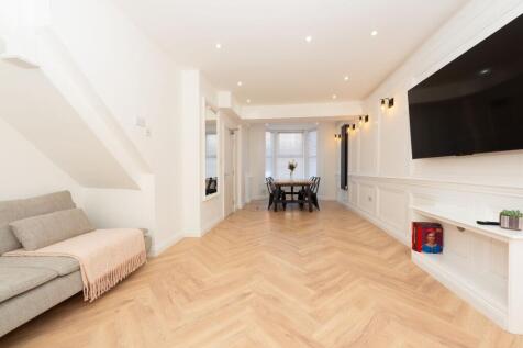 Bright, modern open-plan living and dining spac...