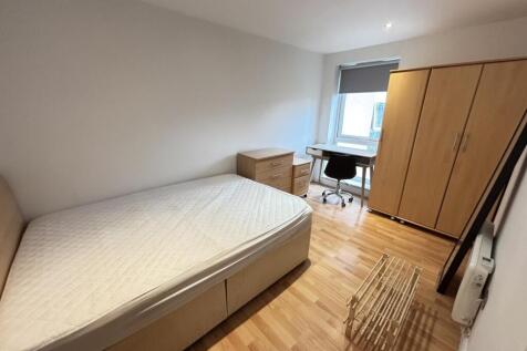A bright and airy double bedroom featuring a co...