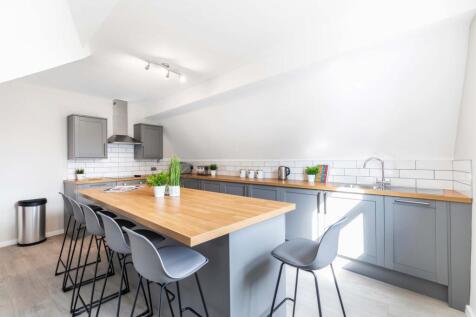 Modern and bright kitchen with ample workspace,...