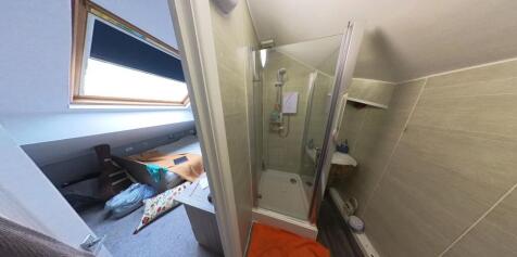 A clean and well-maintained bathroom with a sho...