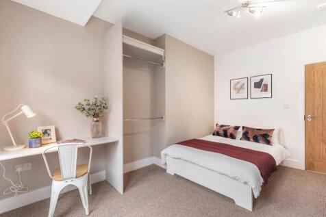 A spacious and well-maintained master bedroom f...