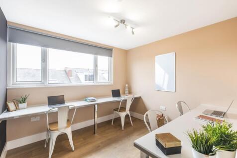 Bright and inviting living room featuring ample...