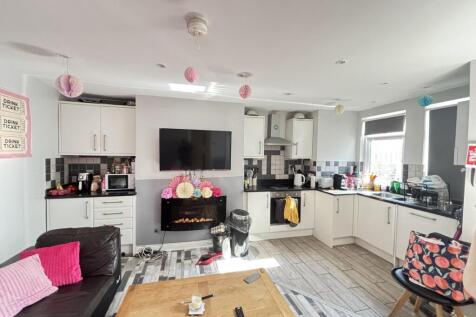 Bright and modern living room featuring ample n...