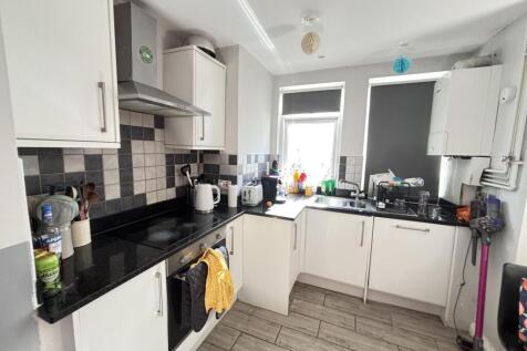 Bright and well-maintained kitchen featuring am...