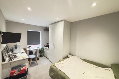 A spacious and well-maintained master bedroom f...