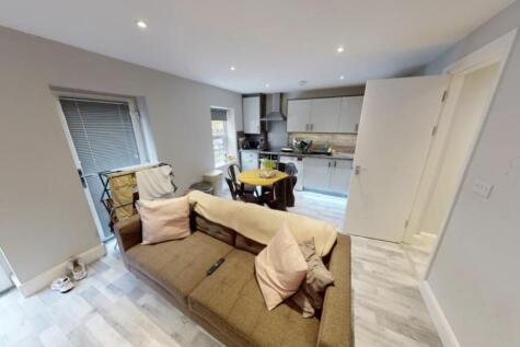 Spacious and bright living room with modern fur...