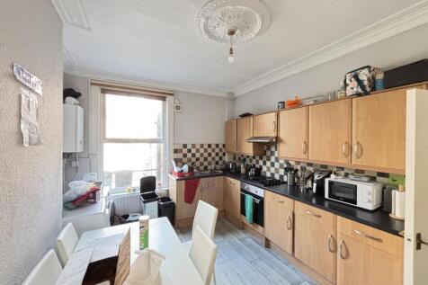 A well-organized kitchen with ample natural lig...