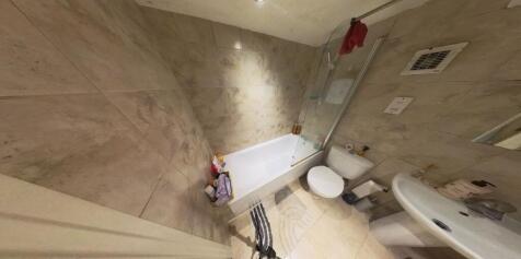 A spacious and well-maintained bathroom featuri...