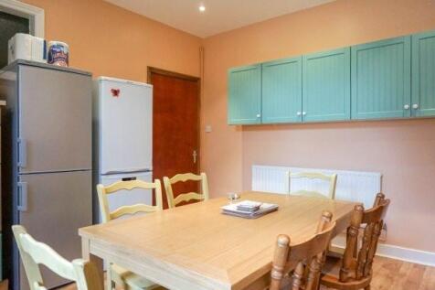 A bright and tidy kitchen with light blue cabin...
