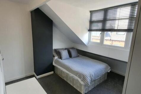 A bright, well-maintained bedroom with a modern...