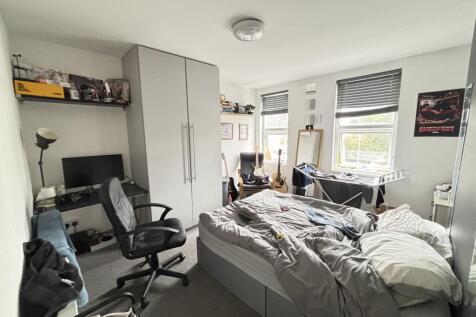 Bright and inviting living room featuring ample...