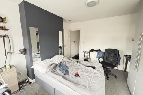 Bright modern double bedroom with a contemporar...