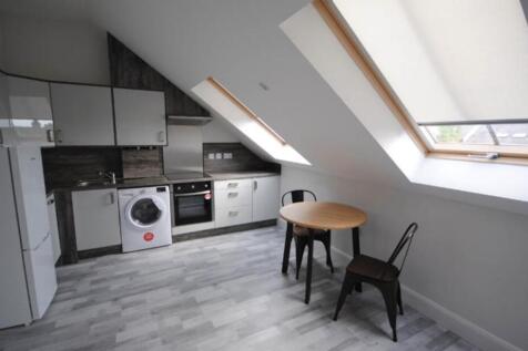 Bright and modern kitchen with ample natural li...