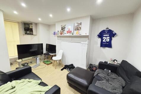 A bright and spacious living room featuring mod...