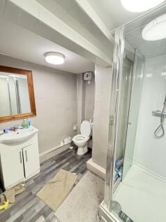 Bright and clean bathroom with a modern shower ...