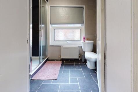 A clean and well-maintained bathroom with a lar...