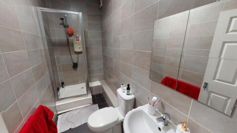 A modern, well-maintained bathroom with a large...