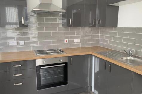 Modern and well-maintained kitchen area with sl...