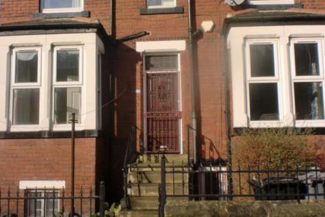 A charming front exterior of a traditional bric...