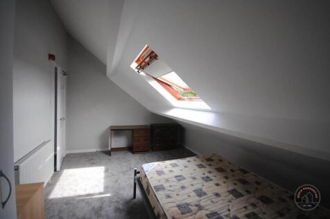 Bright and cozy attic master bedroom with a lar...