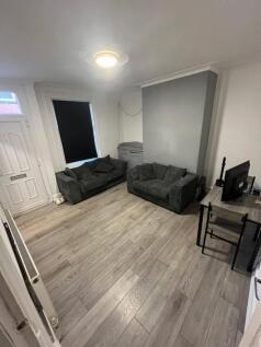 A contemporary and spacious living room featuri...