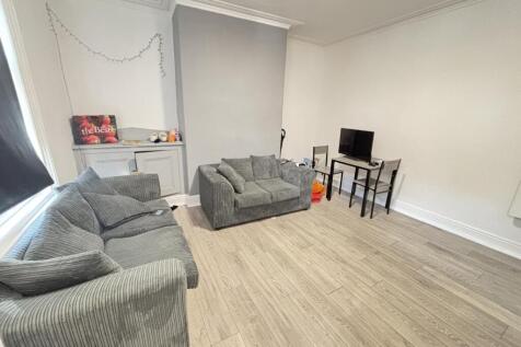 A spacious and well-maintained living room feat...