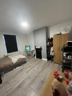 A cozy living room with a comfortable sofa, a s...